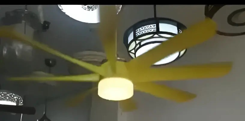 Yellow ceiling fan with cylindrical light and black metal housing luxury industrial ceiling fan for hotel lobby