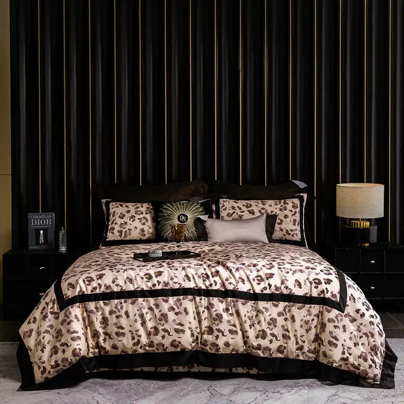 Cream-colored leopard print luxury bedding set with black satin trim and sunburst pillow by decorbites leopard print