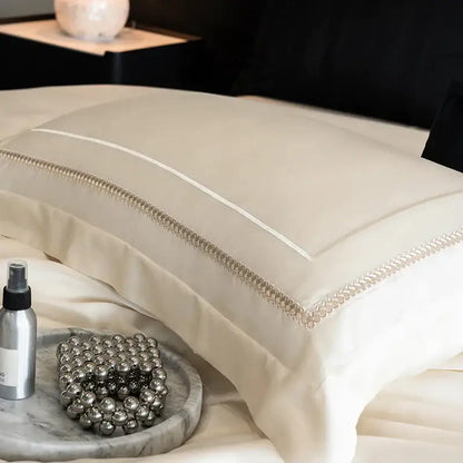 Cream-colored satin pillowcase with silver beaded trim in light champagne luxury bedding set egyptian cotton decorbites