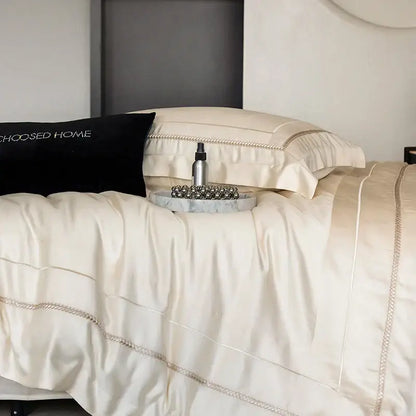 Cream-colored satin bedding set with delicate silver chain embroidery in light champagne luxury egyptian cotton decorbites