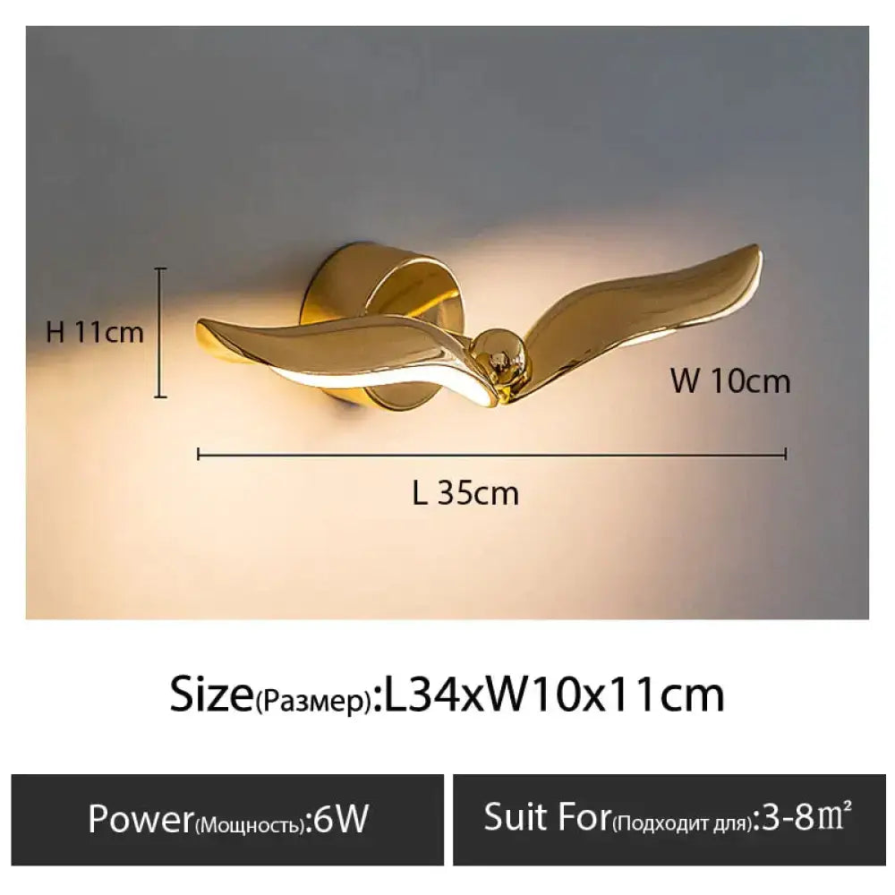Luxury minimalist creative gold-colored wall-mounted seagull lamp designed for bedroom and living room decor