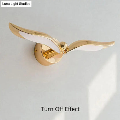 Luxury minimalist creative seagull wall lamp gold-colored with white illuminated flying broomstick design for bedroom living room