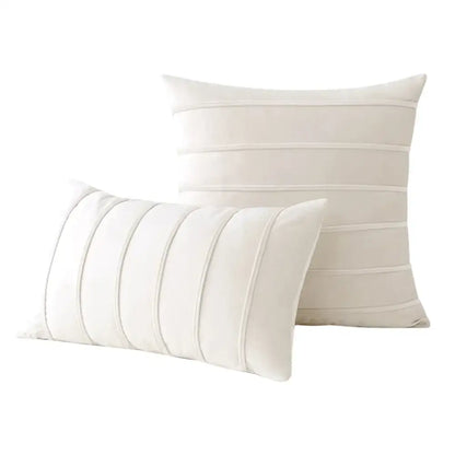 Cream-colored velvet throw pillows with subtle horizontal pleats complement decorbites blue velvet stripe pillow covers