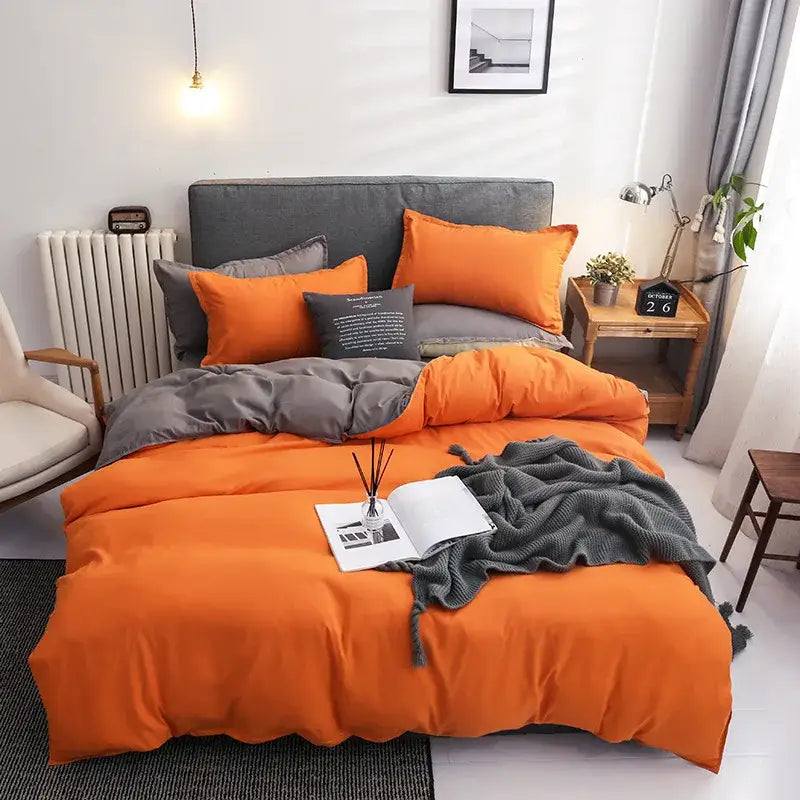 Luxury orange and gray duvet cover set includes matching pillowcases and throw blanket for stylish bedroom bedding