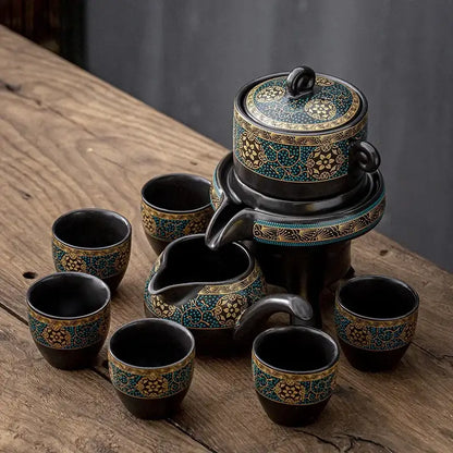 Black ceramic kung fu tea set with intricate turquoise and gold floral patterns for luxury dining room use