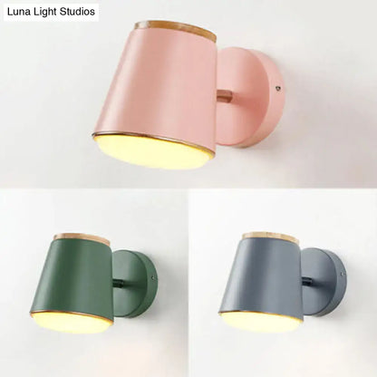 Macaron pink and gold fabric wall lamp with matte finish wooden rim and warm yellow light cylindrical sconce wall light