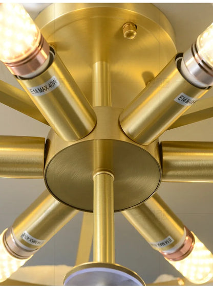 Gold-colored brass marble led chandelier round pendant light with multiple cylindrical arms and illuminated bulbs