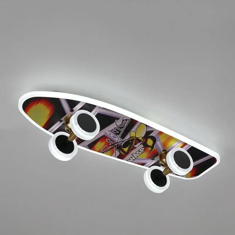 A sleek modern cartoon skateboard ceiling light with vibrant flame and bee graphics for children room decorbites design