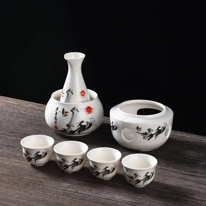 Matte black and light blue decorbites ceramic sake set with white bottles featuring black brushstroke and red accents