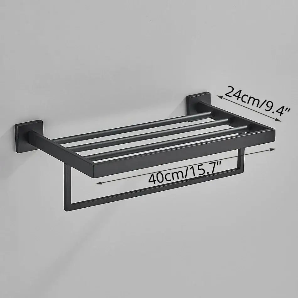 Matte black bathroom accessories set featuring a black matte finished metal towel rack with four bars and lower hanging loop