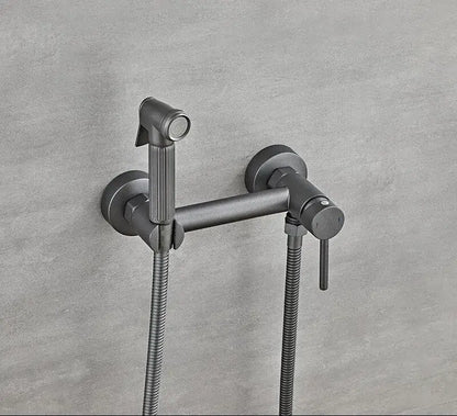 Matte black bidet faucet set with a modern minimalist design and two flexible metal hoses for bathroom use