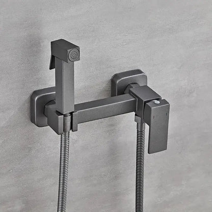 Modern matte black bidet faucet set with integrated handheld sprayer and flexible hoses for bathroom use