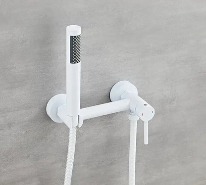 Matte black bidet faucet set with white modern handheld spray head and dual control knobs for bathroom use