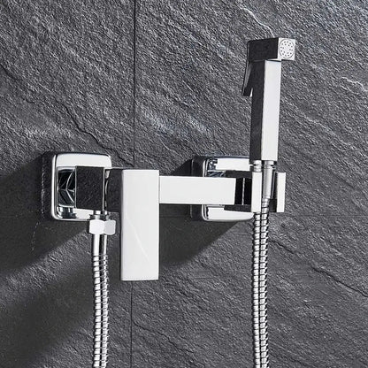 Matte black brass bidet faucet with handheld chrome sprayer featuring sleek angular design and flexible braided hose