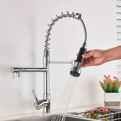 Chrome-finished kitchen faucet with flexible coiled hose and black grip spray head for decorbites brass swivel spout use