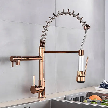 Rose gold kitchen faucet with flexible coiled hose and pull-down spray head in decorbites brass kitchen faucet with swivel spout