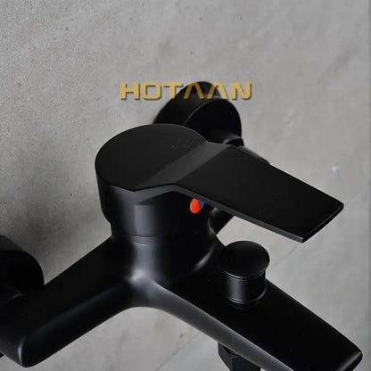 Matte black finish shower faucet with handheld mixer featuring modern angular design and orange indicator dot decorbites black finish