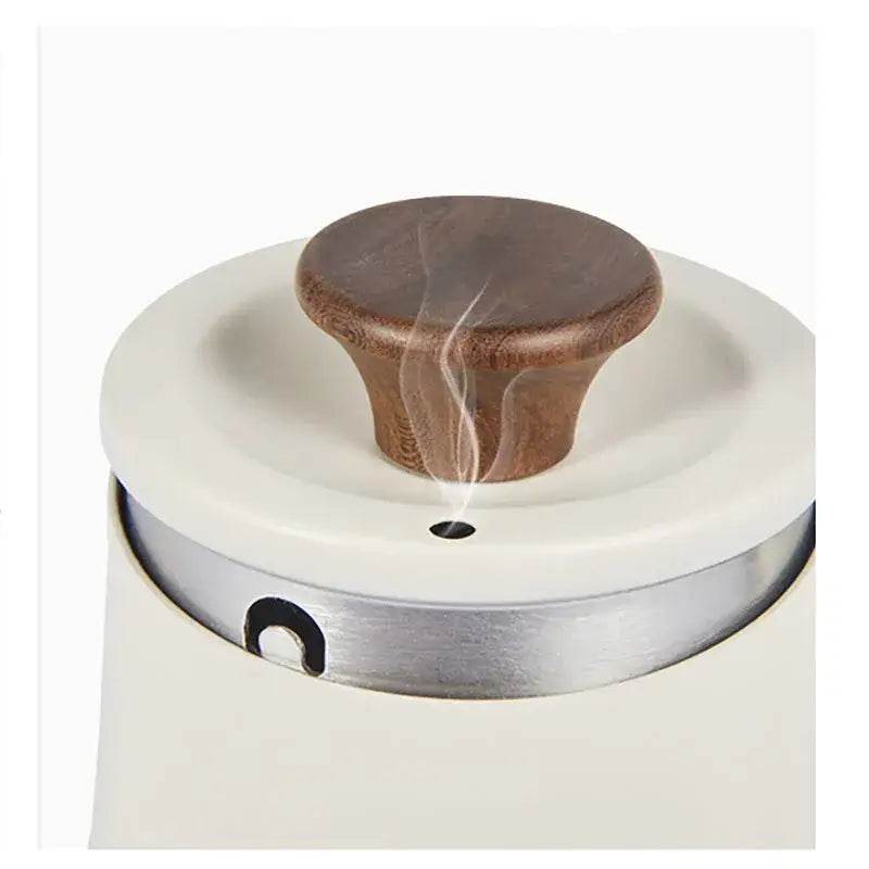 Cream-colored ceramic espresso maker with polished wooden knob and stainless steel rim for decorbites gooseneck pour accessory