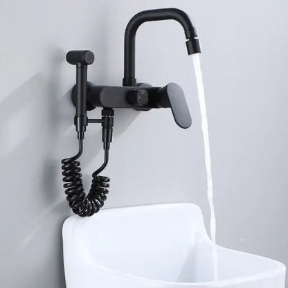 Matte black kitchen mixer tap with curved spout and integrated handheld showerhead on coiled hose wall mounted