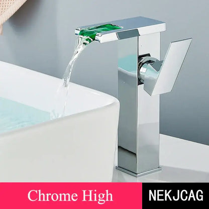 Matte black led waterfall basin faucet with temperature display and chrome finished spout with green glass accent