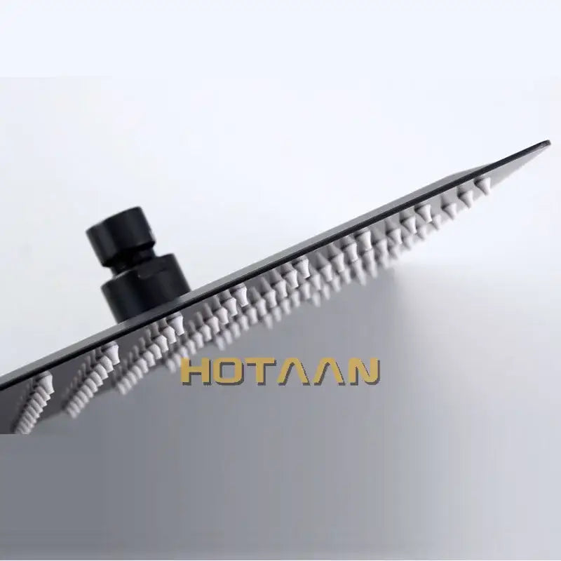 Matte black square rain shower head with sleek modern design and rows of nozzles decorbites black rain fixture