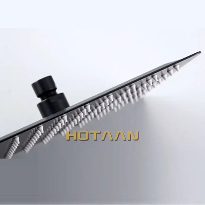 Matte black square rain shower head with sleek modern design and rows of nozzles decorbites black rain fixture