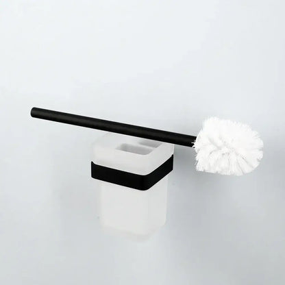 Black and white toilet brush with matte black handle and soft white bristles in a matte black stainless steel bathroom hardware set