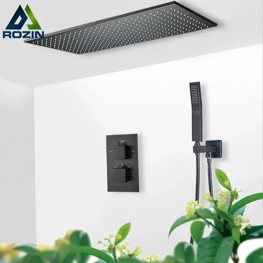 Matte black thermostatic shower faucet with a rectangular ceiling shower head featuring evenly spaced perforations