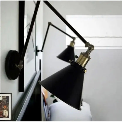 Matte black umbrella wall lights with brass accents featuring black umbrella lampshade and articulated arms for decorbites living room