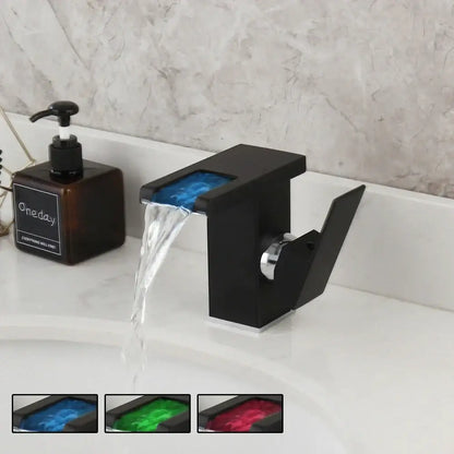 Matte black basin faucet with blue decorbites led waterfall spout and chrome accents for bathroom mixer tap