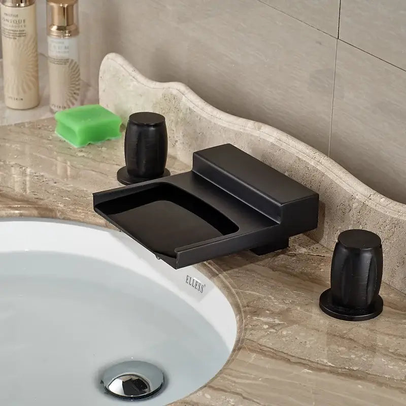 Matte black wide waterfall spout bathroom faucet with black matte finish, integrated soap dish, and square handles for decorbites black wide design