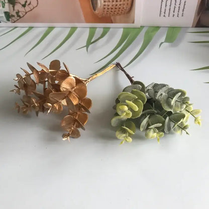 Two decorbites artificial ferns shrubs with matte gold and muted green synthetic eucalyptus sprigs for living room decor