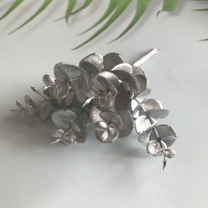 Matte gold, silver, and green artificial ferns shrubs featuring silver metallic eucalyptus leaf cluster decorbites artificial ferns decor