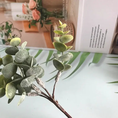Matte gold silver and green artificial ferns shrubs featuring a faux eucalyptus branch with frosted leaves for decorbites artificial use
