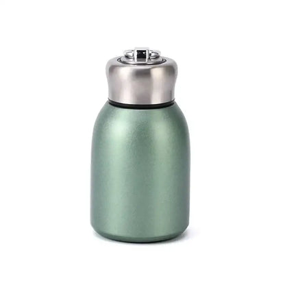 Matte sage green stainless steel vacuum flask with silver lid and black seal designed as a travel water bottle