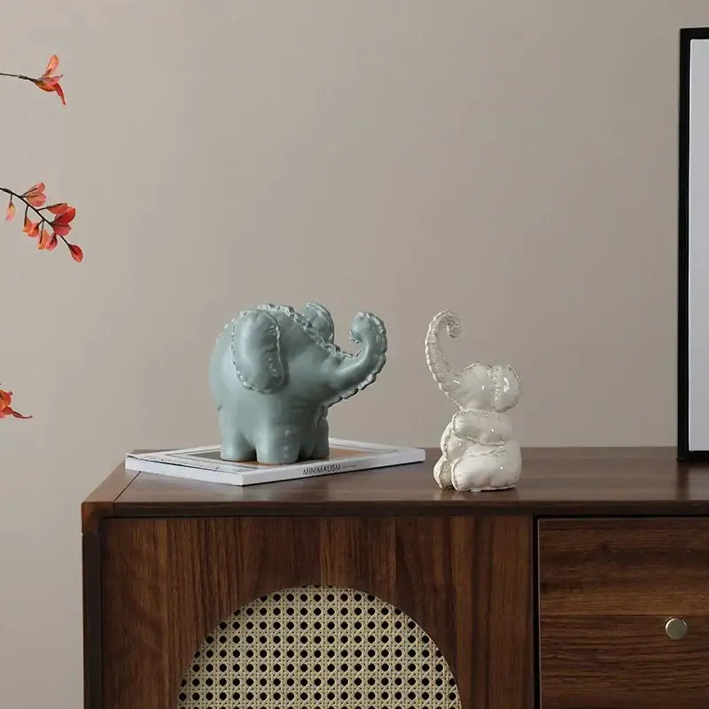 Matte light blue ceramic elephant figurine with textured trunk and ears for home decor and decorbites elephant abstract collection
