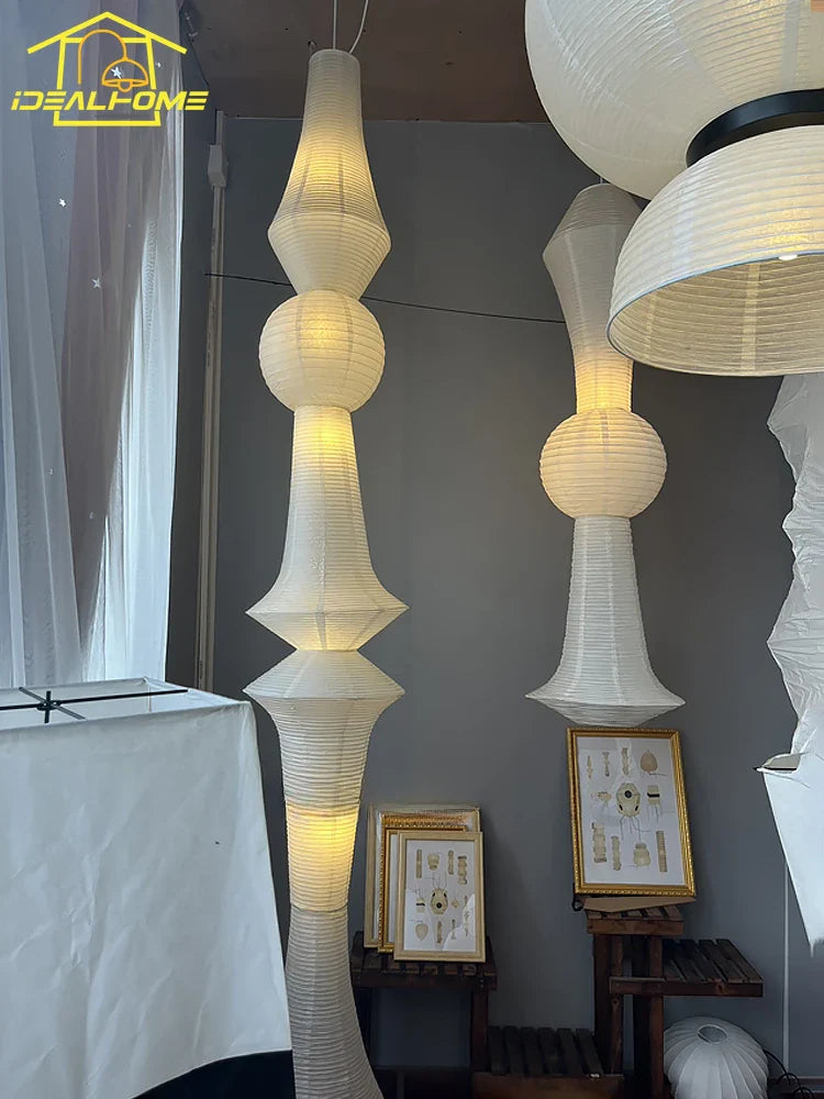 White paper pendant lights with tiered spherical and conical sections made of akari noguchi rice paper for home decor