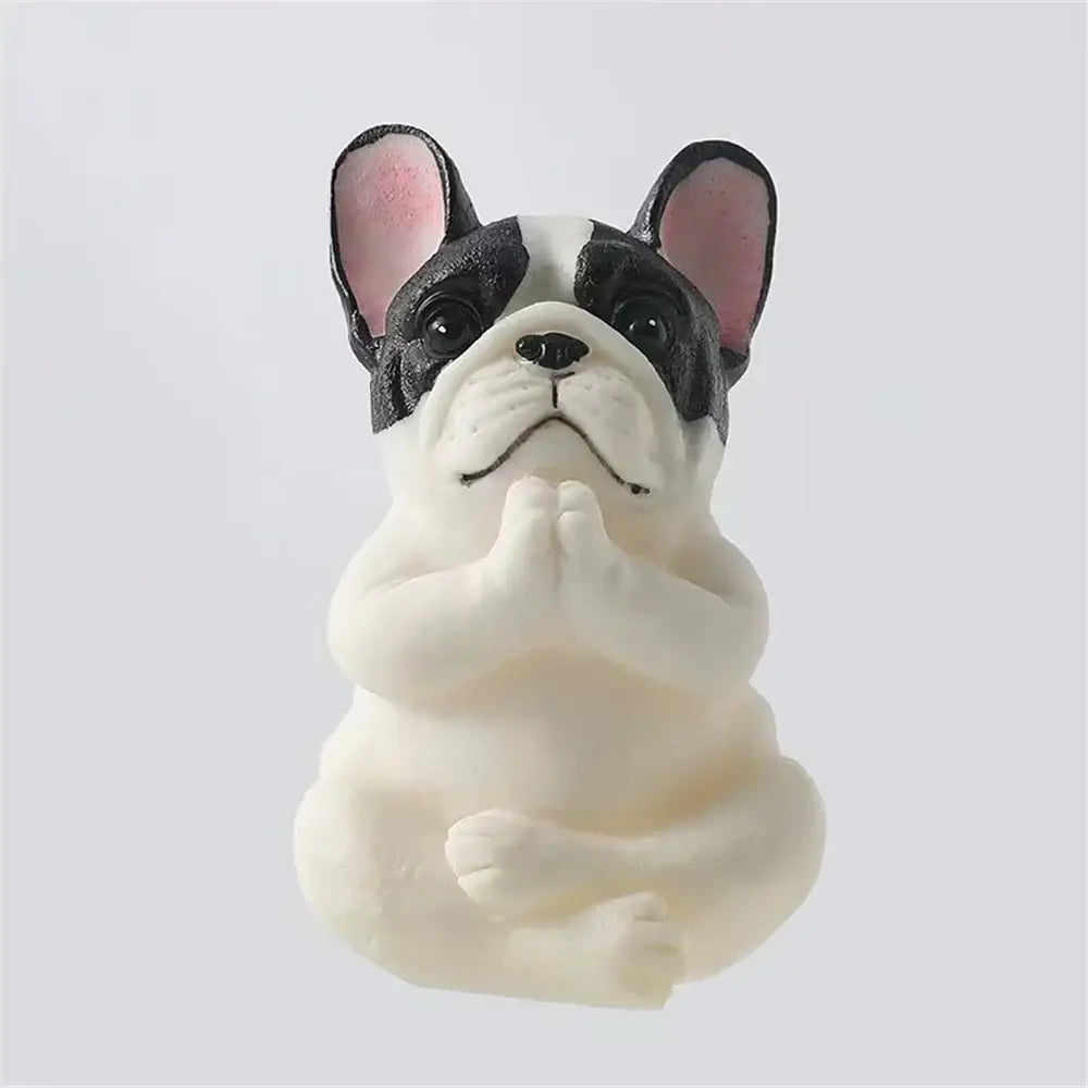 A charming black and white meditative bulldog resin statue with pink inner ears from decorbites bulldog resin set