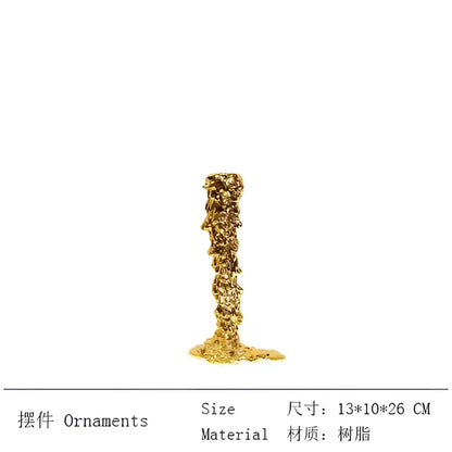 Golden textured resin candlestick holder with rough organic surface and slightly melted base for dining room decorbites decor
