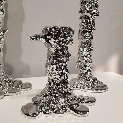 Shiny silver candlestick holder with molten-metal texture featuring sculptural irregular surfaces for decorbites golden candlestick decor
