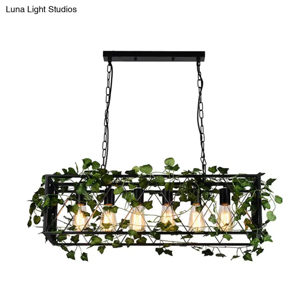Decorbites metal island pendant in antique black rectangular design with five filament bulbs and green ivy vines woven through frame