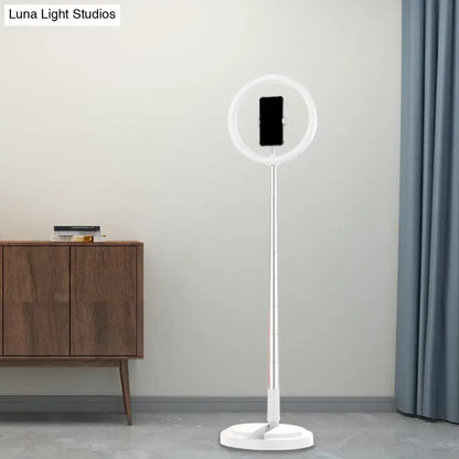 Metallic black led makeup lamp with phone holder featuring a white ring light and sleek metallic stand for bedroom use