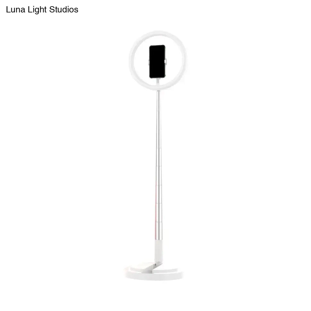Metallic black led makeup lamp with white ring light, slim adjustable stand, and smartphone holder for bedroom use