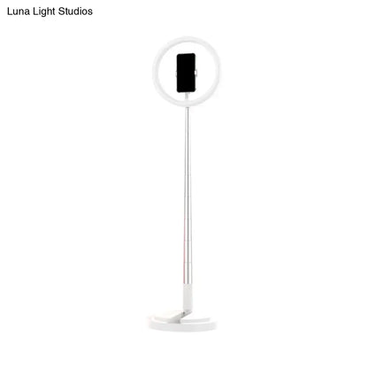 Metallic black led makeup lamp with white ring light, slim adjustable stand, and smartphone holder for bedroom use