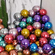 A vibrant pack of 10 metallic chrome golden balloons in gold silver purple teal and red for wedding party decor