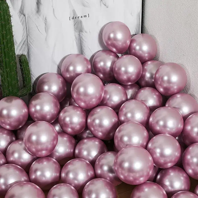 A pile of shiny rose gold metallic chrome golden balloons for wedding party decor pack of 10