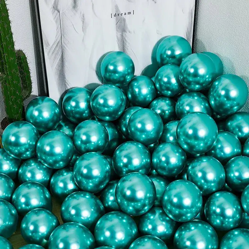 Shiny teal metallic balloons piled together alongside chrome golden balloons pack of 10 for wedding party decor