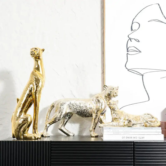 Metallic gold and silver leopard resin sculpture with textured reflective surfaces for living room decorbites leopard resin decor