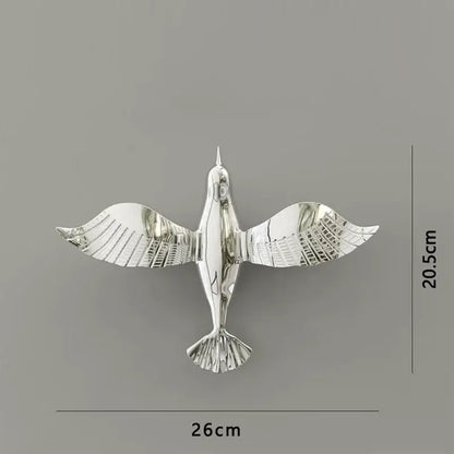 Silver metallic pigeon wall decor with detailed wing and tail feathers perfect for living room dove statue display