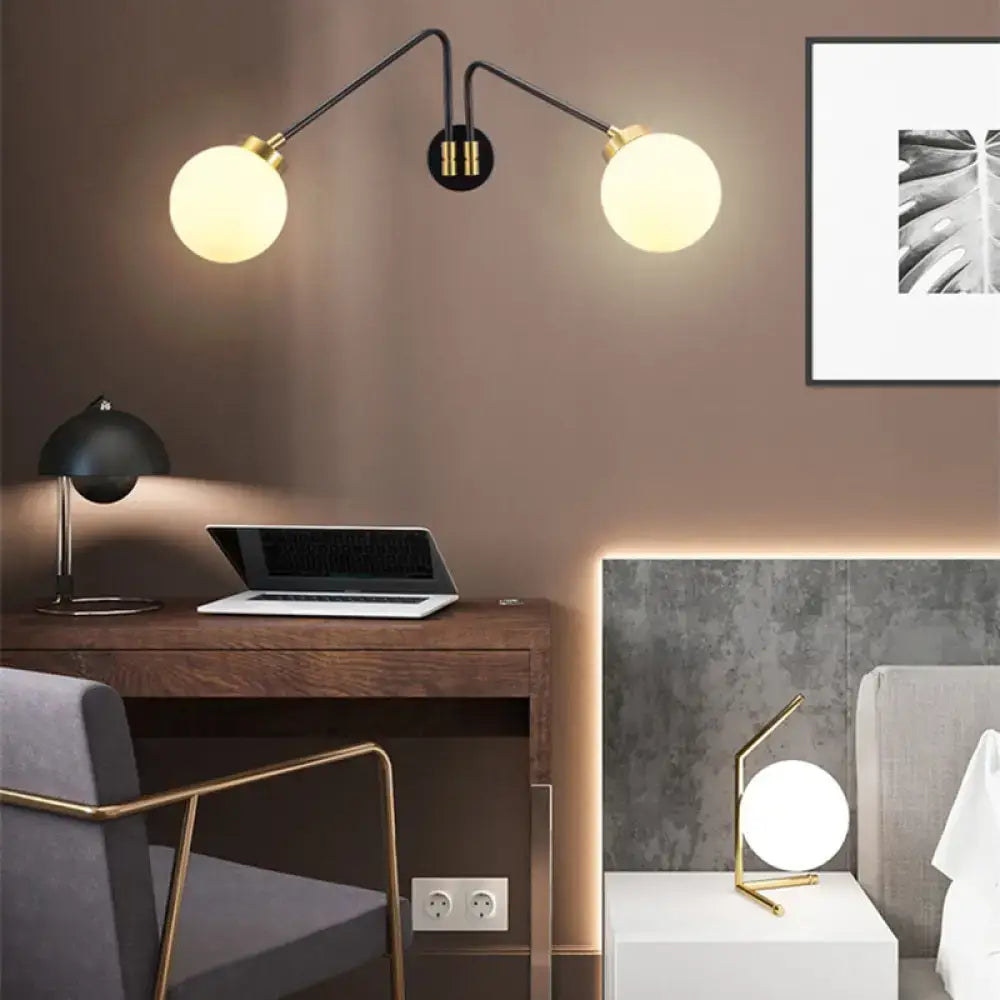 Modern black and brass double-arm wall sconce with opal frosted glass shades for e26 e27 bulbs in bedroom use